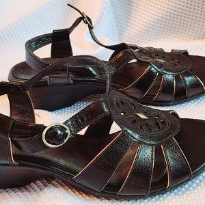 Clarks black leather sandal with ankle strap and bronze accent